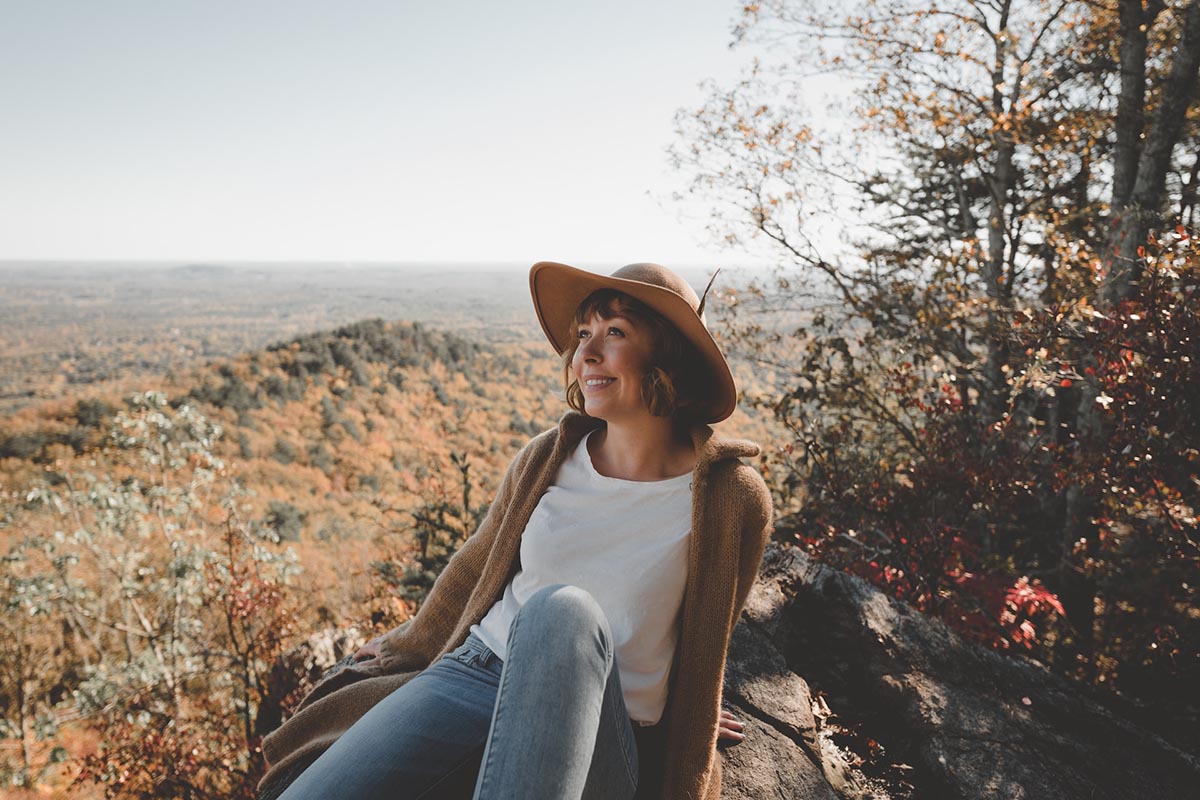 A woman enjoys the sunshine at Crowders Mountain State Park in North Carolina.